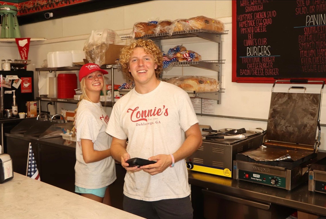 Austin and Phoebe smiling together outdoors
